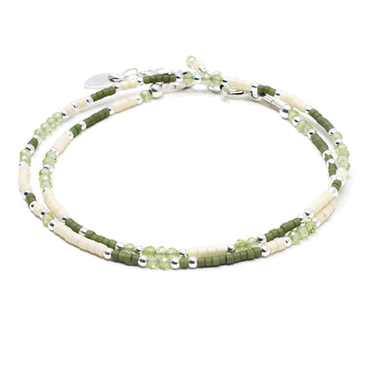 Minimalist beaded wrap bracelet with peridot gemstones and green glass beads