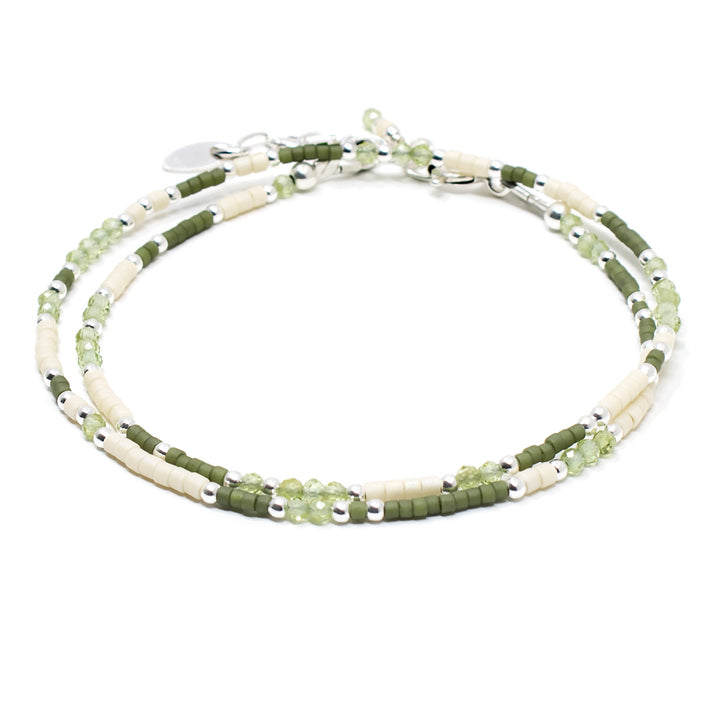 Minimalist beaded wrap bracelet with peridot gemstones and green glass beads