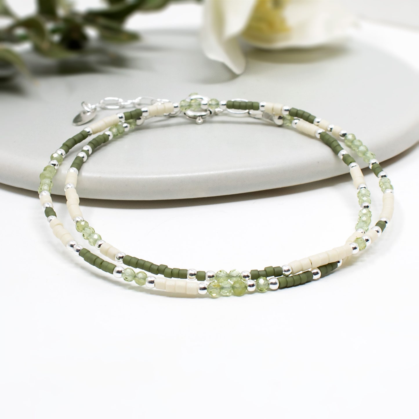 Handmade skinny designer beaded bracelet in sterling silver and mixed green beads