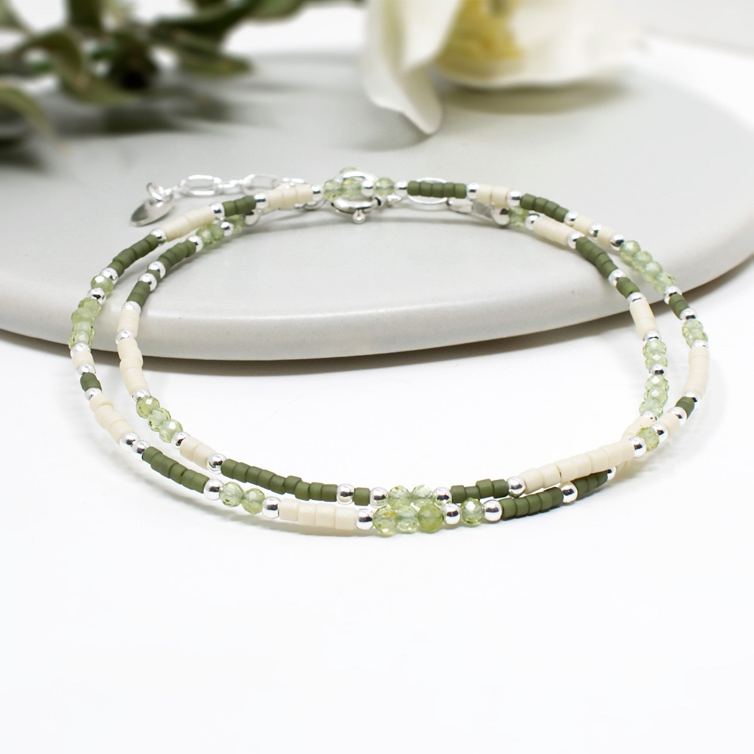 Handmade skinny designer beaded bracelet in sterling silver and mixed green beads