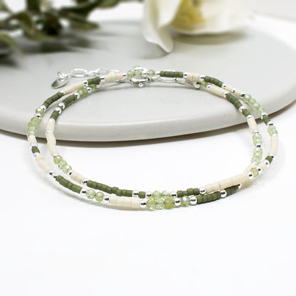 Handmade skinny designer beaded bracelet in sterling silver and mixed green beads